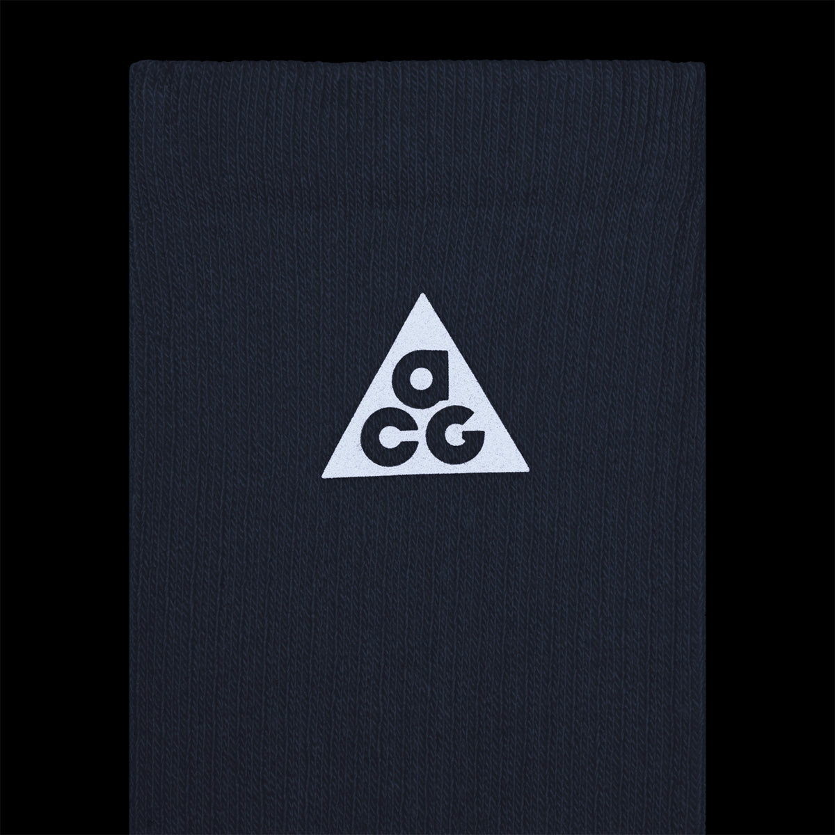 Nike ACG Everyday Elevated Crew Socks Photon Dust College Grey close-up of reflective logo detail showing ACG branding and visibility features