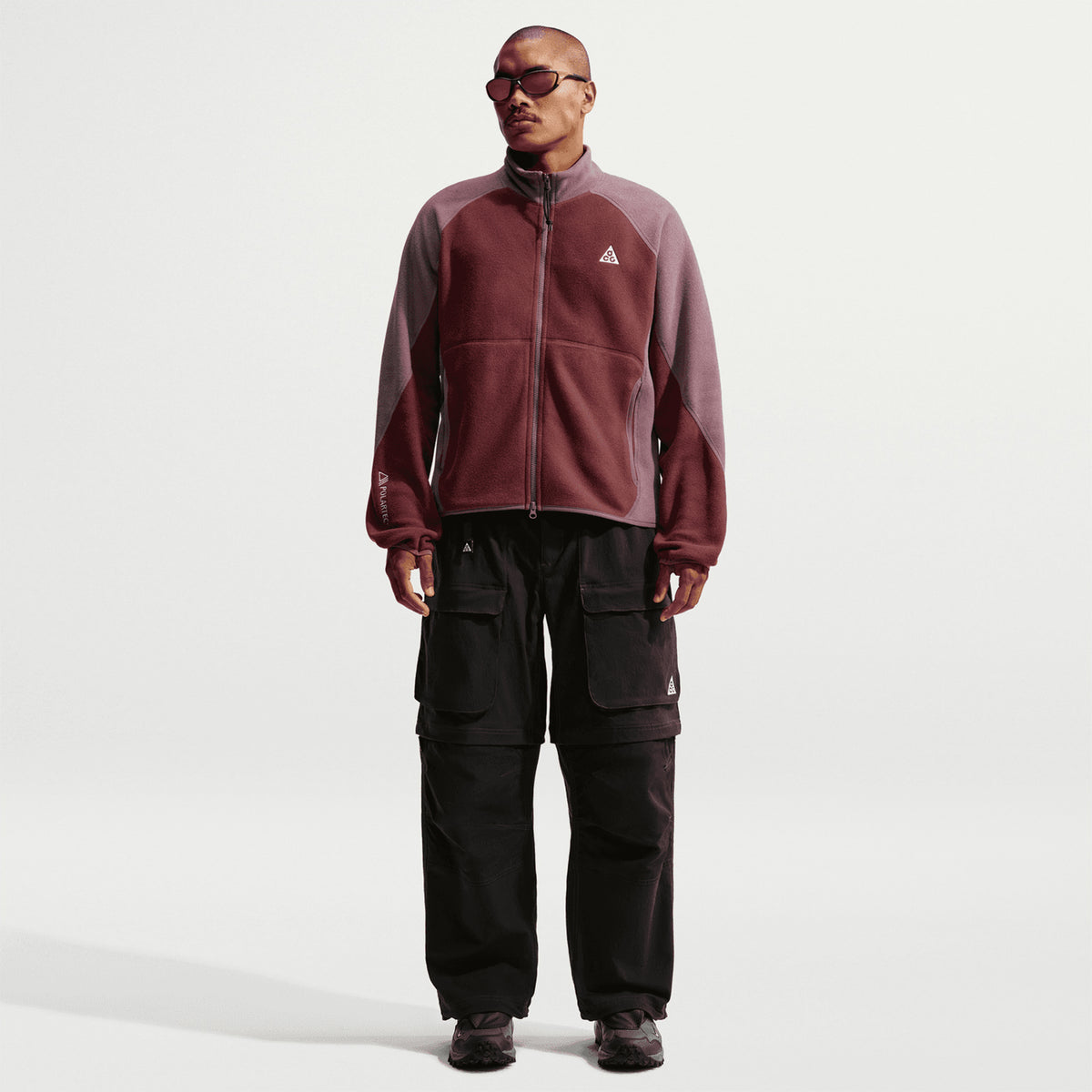 Nike ACG Wolf Tree Full Zip Jacket Mystic Dates Tattoo Summit White full body view on model showing classic fit with Polartec fleece and 2-way zipper for versatile trail mid-layer use