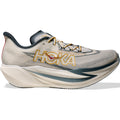 The Hoka Cielo X1 3.0 Running Shoes in Alabaster and Yellow Gold feature a beige and gray colorway with a gold logo, thick cushioned PEBA midsole, and dark accents, shown from the side on a white background.