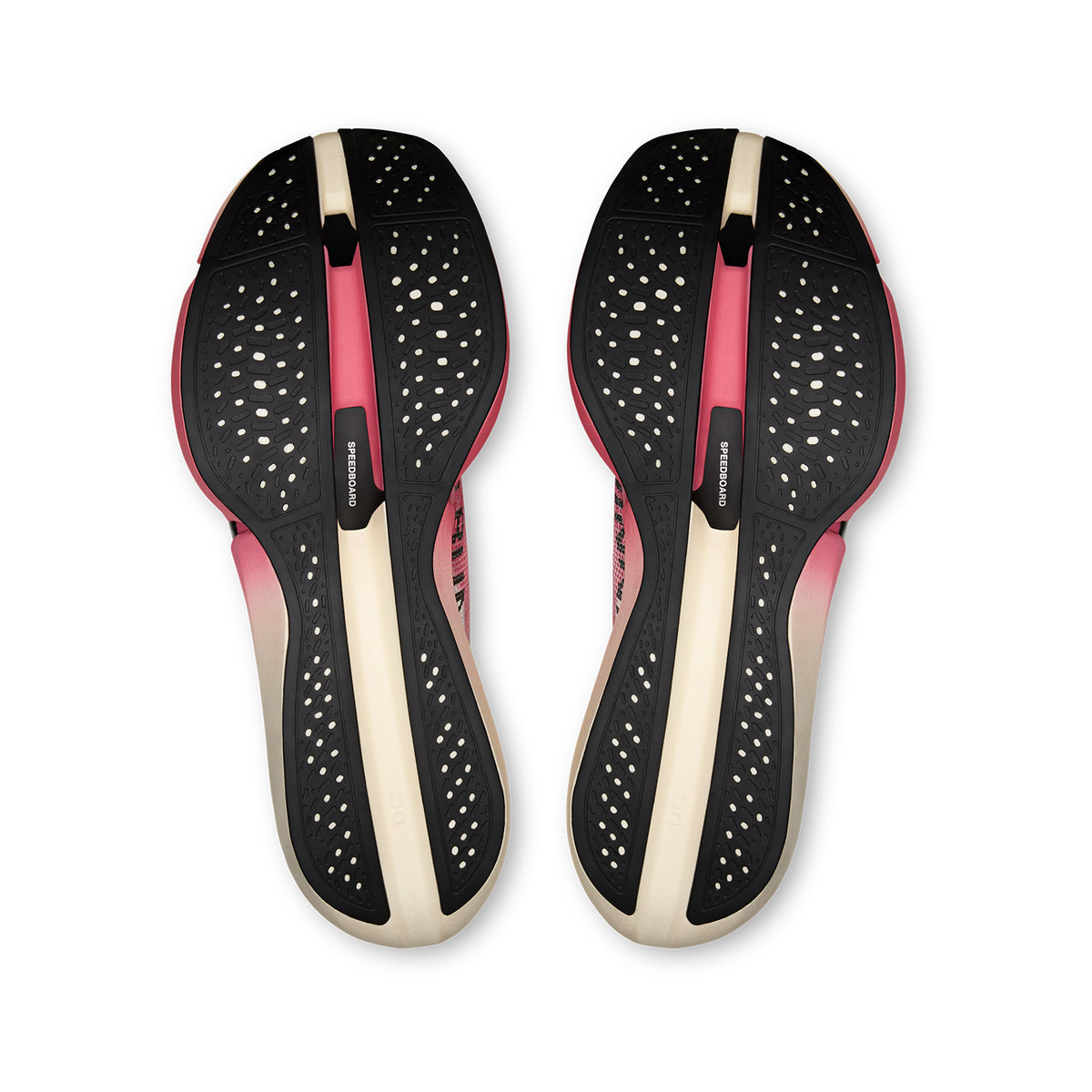 A pair of On Cloudboom Strike 2 White / Camellia marathon racing shoe soles, viewed from above against a white background, showcases black and pink tread, white dots, and beige toes. The design features CloudTec Sphere cushioning for optimal comfort and performance.