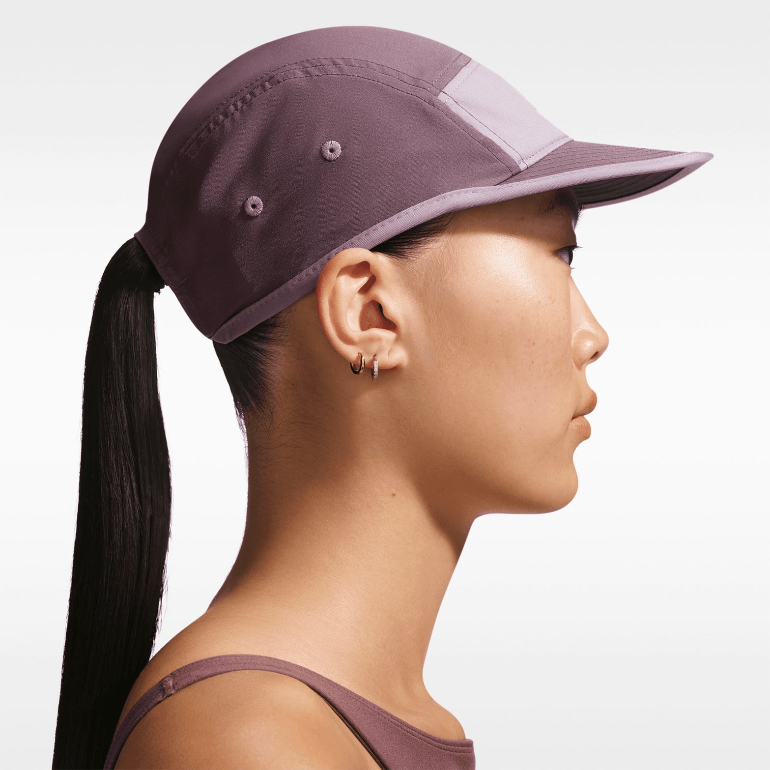 Nike Fly Unstructured Swoosh Cap Tattoo LT Violet Ore Sea Glass side view showing unstructured crown with four-way stretch twill fabric and Dri-FIT moisture-wicking construction