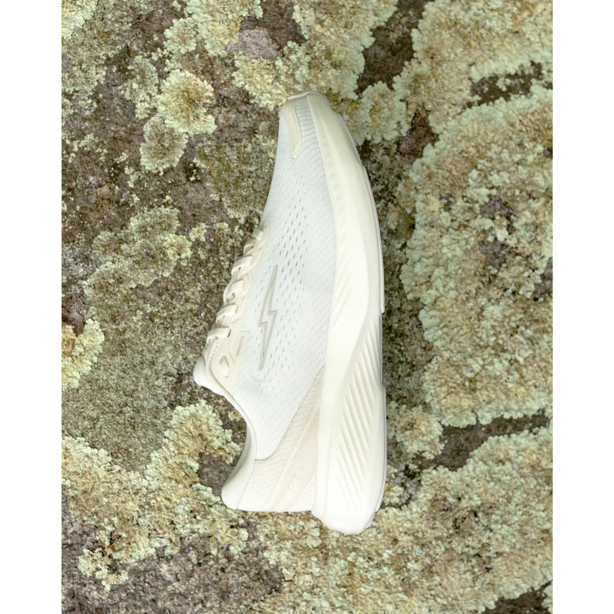 Hylo Impact 2 Running Shoes Undyed Pebble lifestyle shot showing outer side with HyperBolt+ bio-based foam midsole and TreadLight natural rubber outsole in everyday wear setting