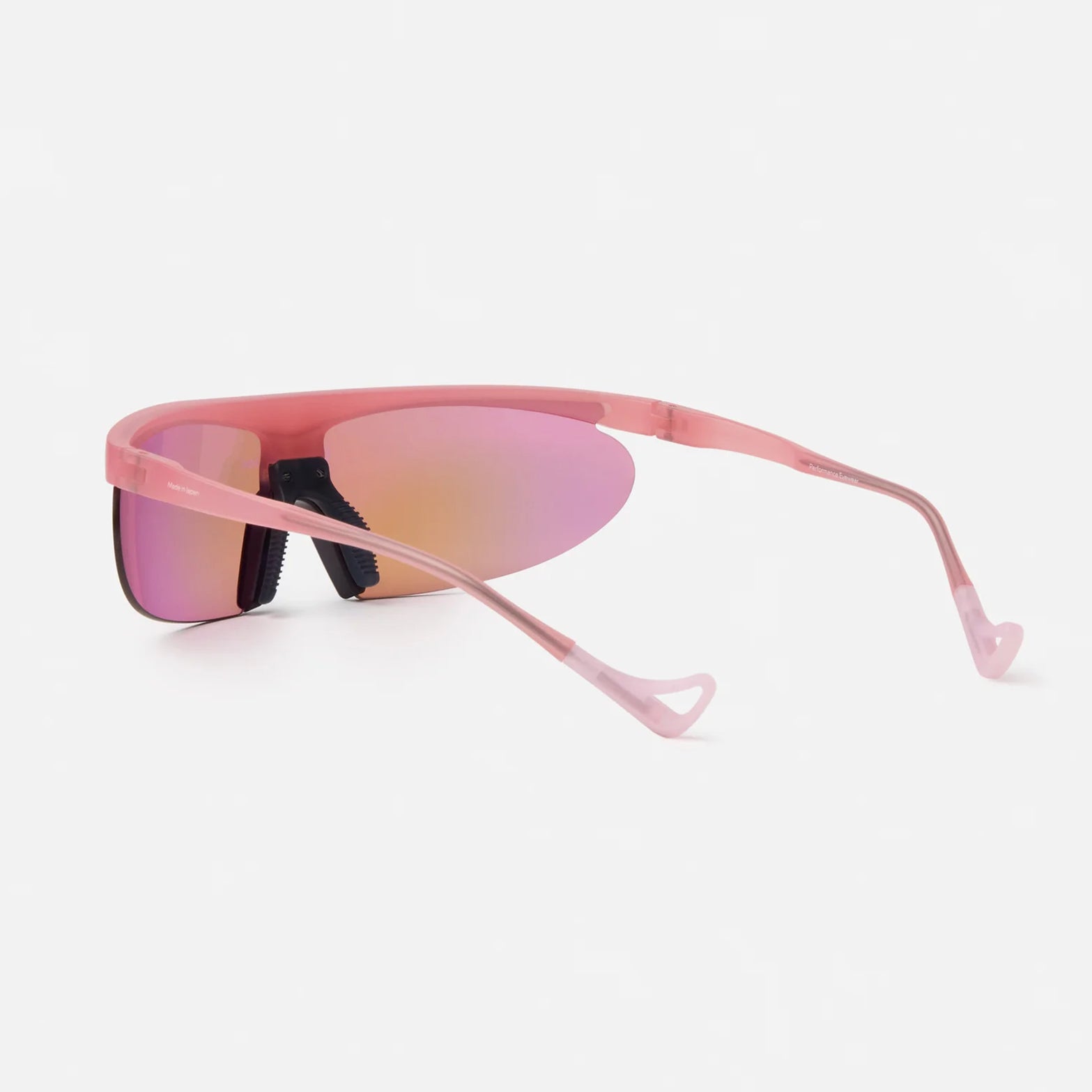 District Vision Koharu Eclipse in Desert Rose D+ Aqua Mirror — back product shot showing adjustable nose pads, temple tip detail and grade 2 titanium core construction on desert rose frame