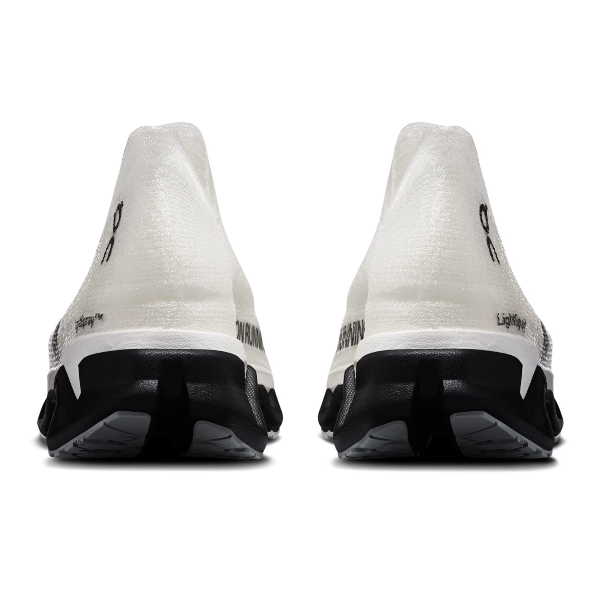 On Cloudmonster 3 Hyper LS women's running shoe in Black / Apollo — heel view showing enhanced rocker geometry, seamless construction and apollo CloudTec® midsole contrast with Helion™ foam base