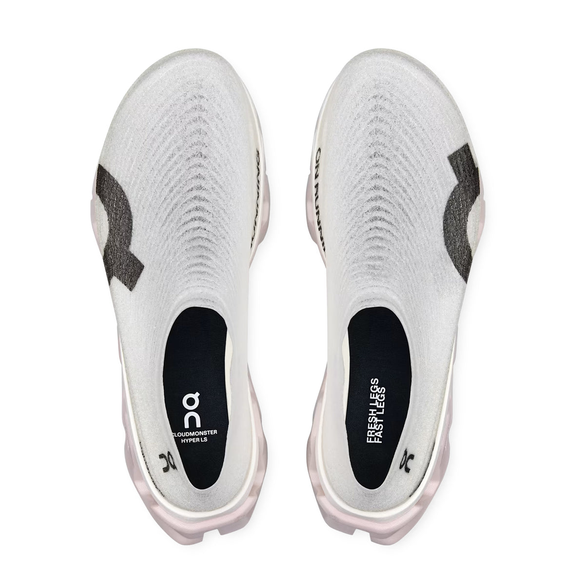 Top view of a pair of white LightSpray Cloudmonster 3 Hyper Lily / Limelight slip-on athletic shoes by On, featuring black branding on the sides and black insoles with the words “CLOUDMONSTER HYPERS” and “FRESH LEGS, FRESH KICKS.” Engineered with the CloudTec® cushioning system for superior comfort, these shoes deliver ultimate performance and style.
