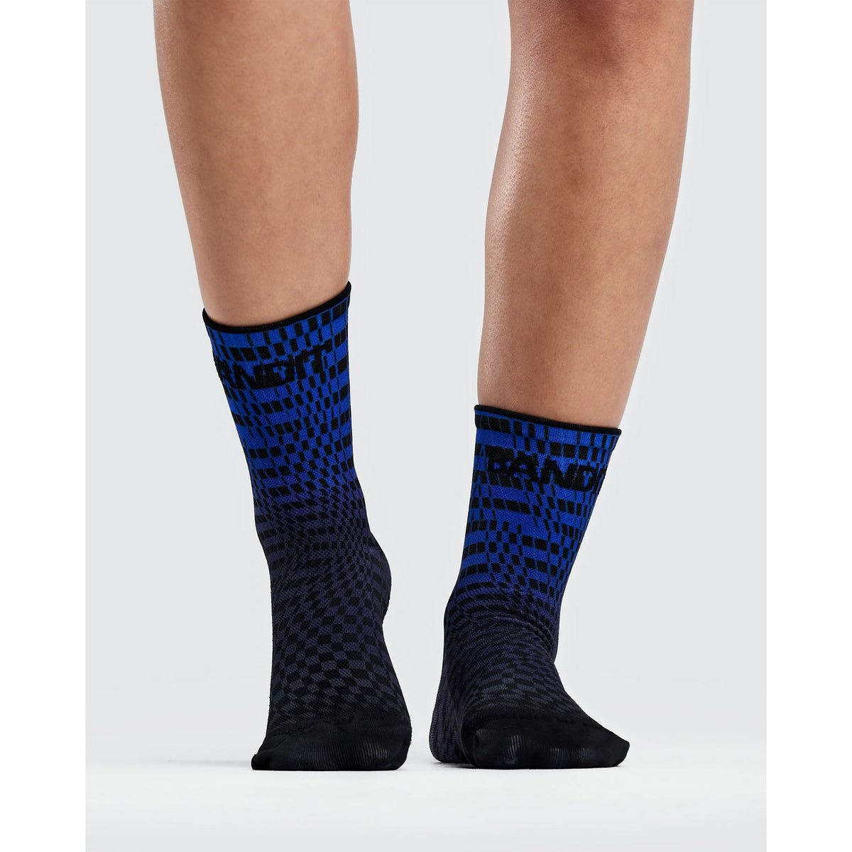 Bandit Lite Run 2 Pack Quarter Socks Bauhaus Blue with a blue and black checkerboard gradient pattern, vertical BANDIT text on the cuffs, and spandex compression.