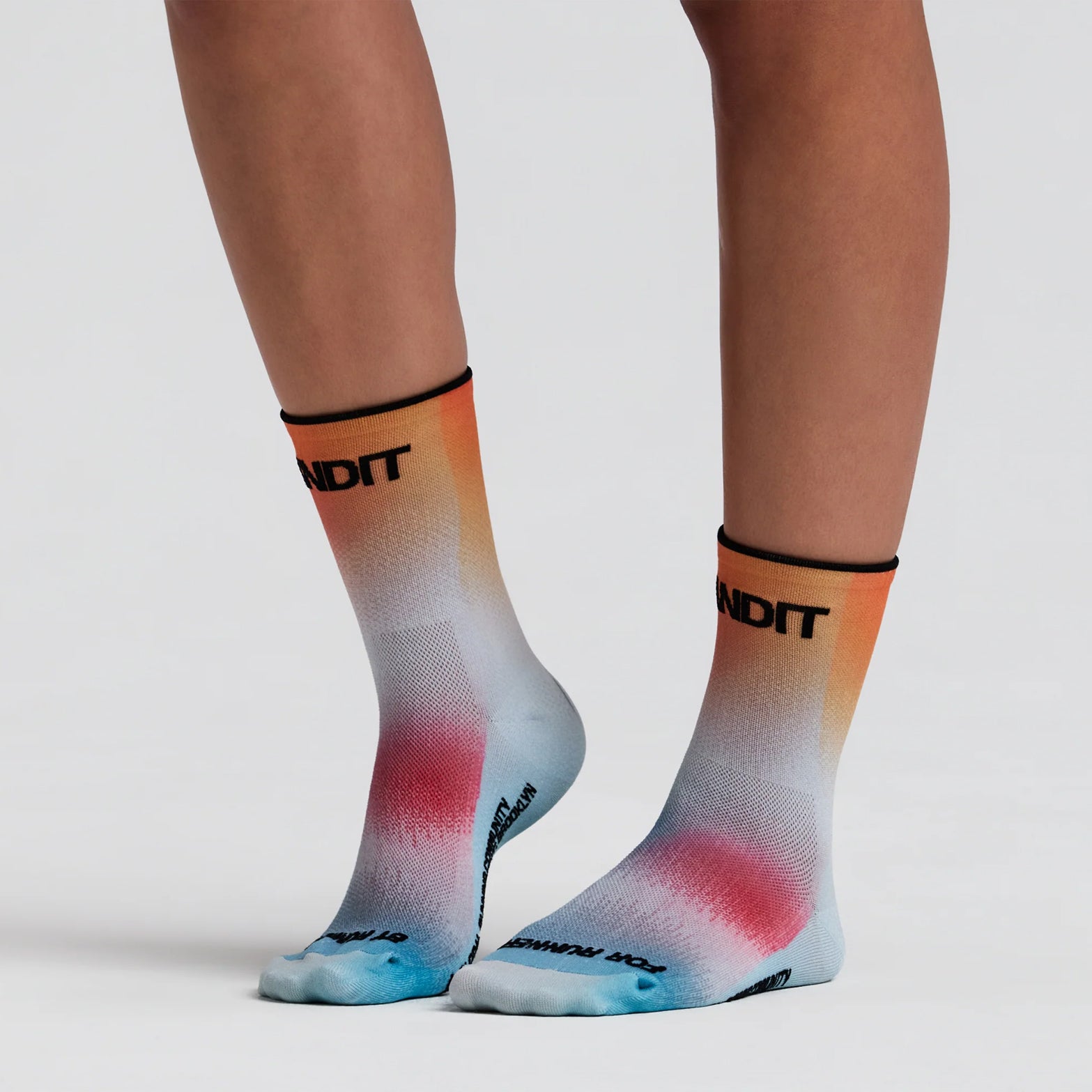 Bandit Lite Run 2 Pack Quarter Socks Lagoon Copal on runner showing quarter-length cut with honeycomb mesh crown and spandex compression for featherweight breathable running performance