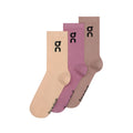 Three pairs of the On Logo Socks High in Sherbet and Rhodonite—a 3-pack featuring beige, mauve, and light brown crew socks—are shown overlapping side by side. Each versatile training sock displays a black On logo near the top and branded text along the toe.