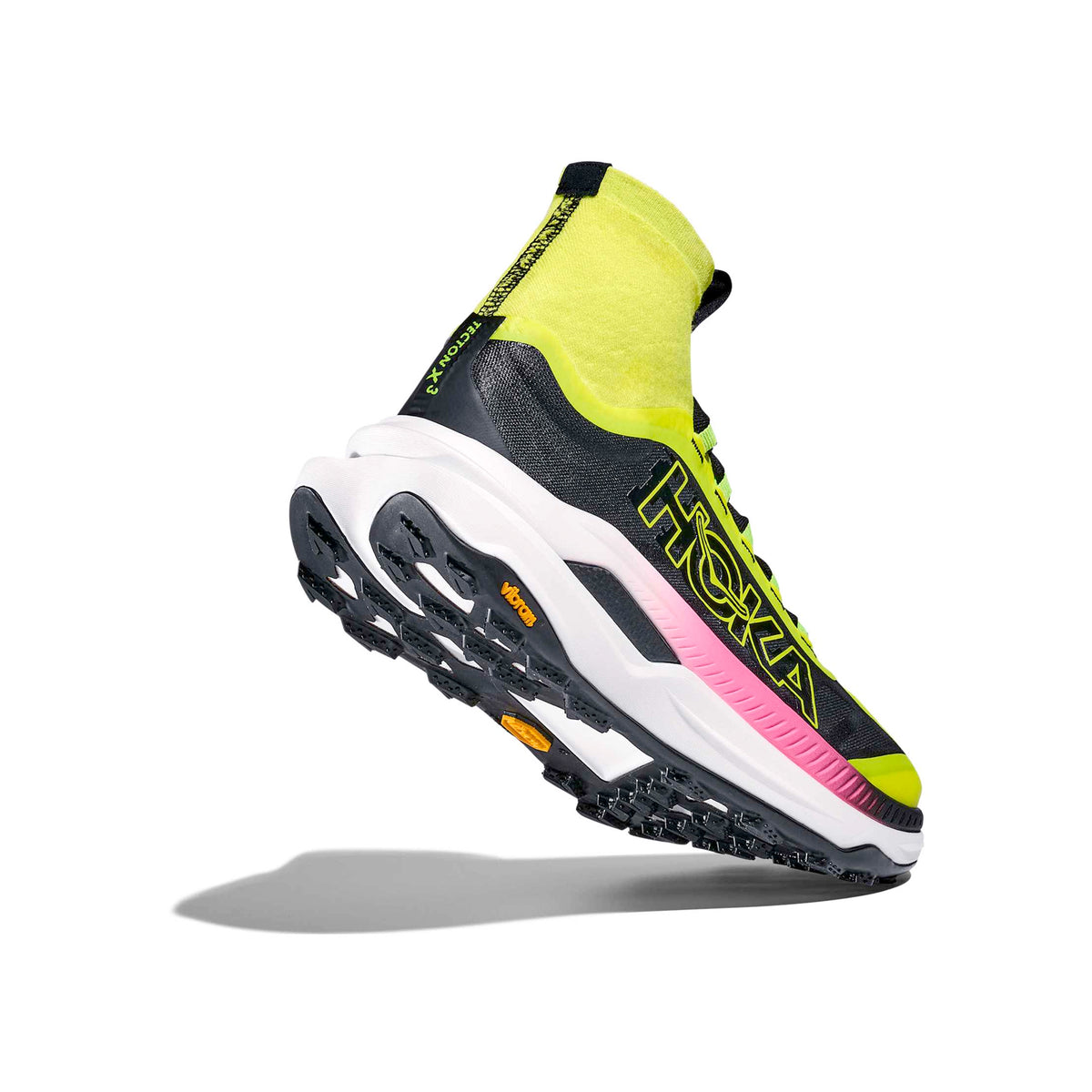A black and neon yellow athletic shoe with a high ankle collar, thick white sole, and pink and yellow accents, shown at an angle on a white background.