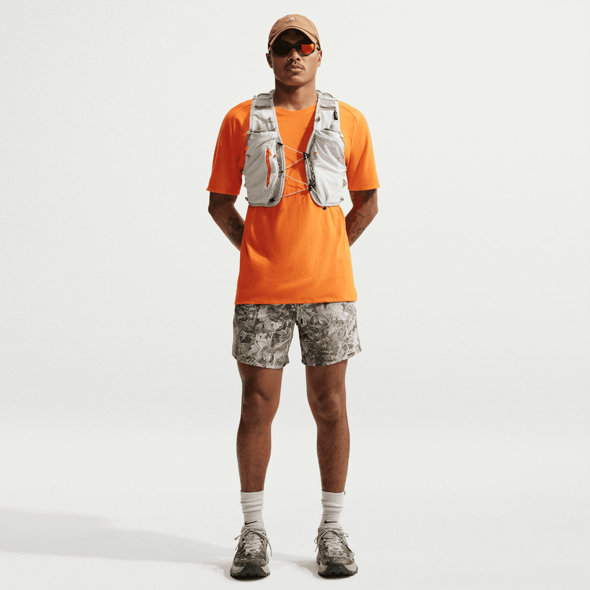 Men's Nike ACG 6 Inch Running Shorts Sequoia Light Army Summit White front full body view on male trail runner showing lightweight breathable construction with four-way stretch panels and Dri-FIT technology for outdoor running and hiking
