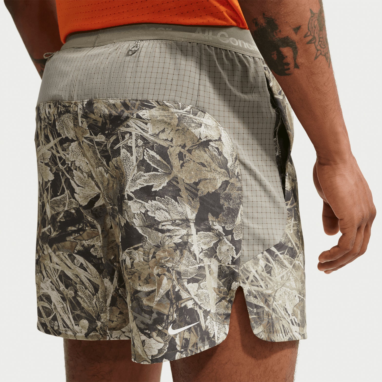 Men's Nike ACG 6 Inch Running Shorts Sequoia Light Army Summit White back view on male trail runner showing two back drop-in pockets with lightweight breathable construction and ACG branding