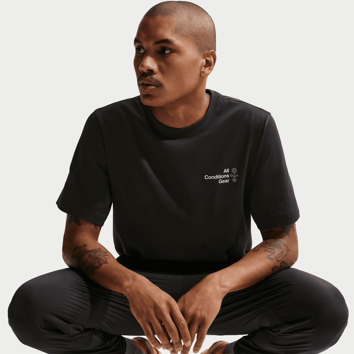 Nike ACG Men's Dri-FIT T-Shirt worn by male model front view showing sweat-wicking fabric, relaxed fit and versatile everyday design