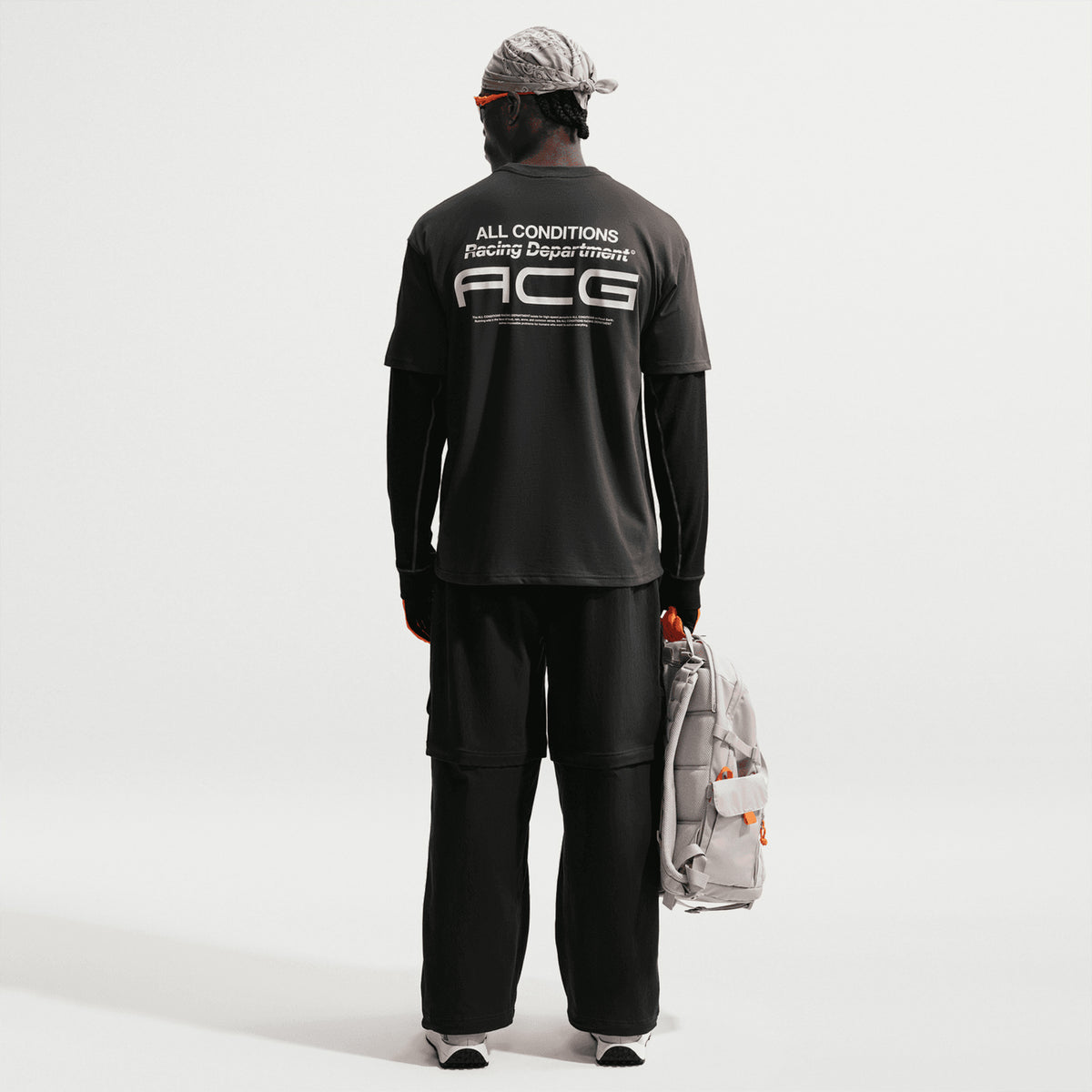 Men's Nike ACG Dri-FIT Tee Dark Smoke Grey back full body view on model showing relaxed cotton-polyester blend construction with Dri-FIT technology for comfortable all-day wear