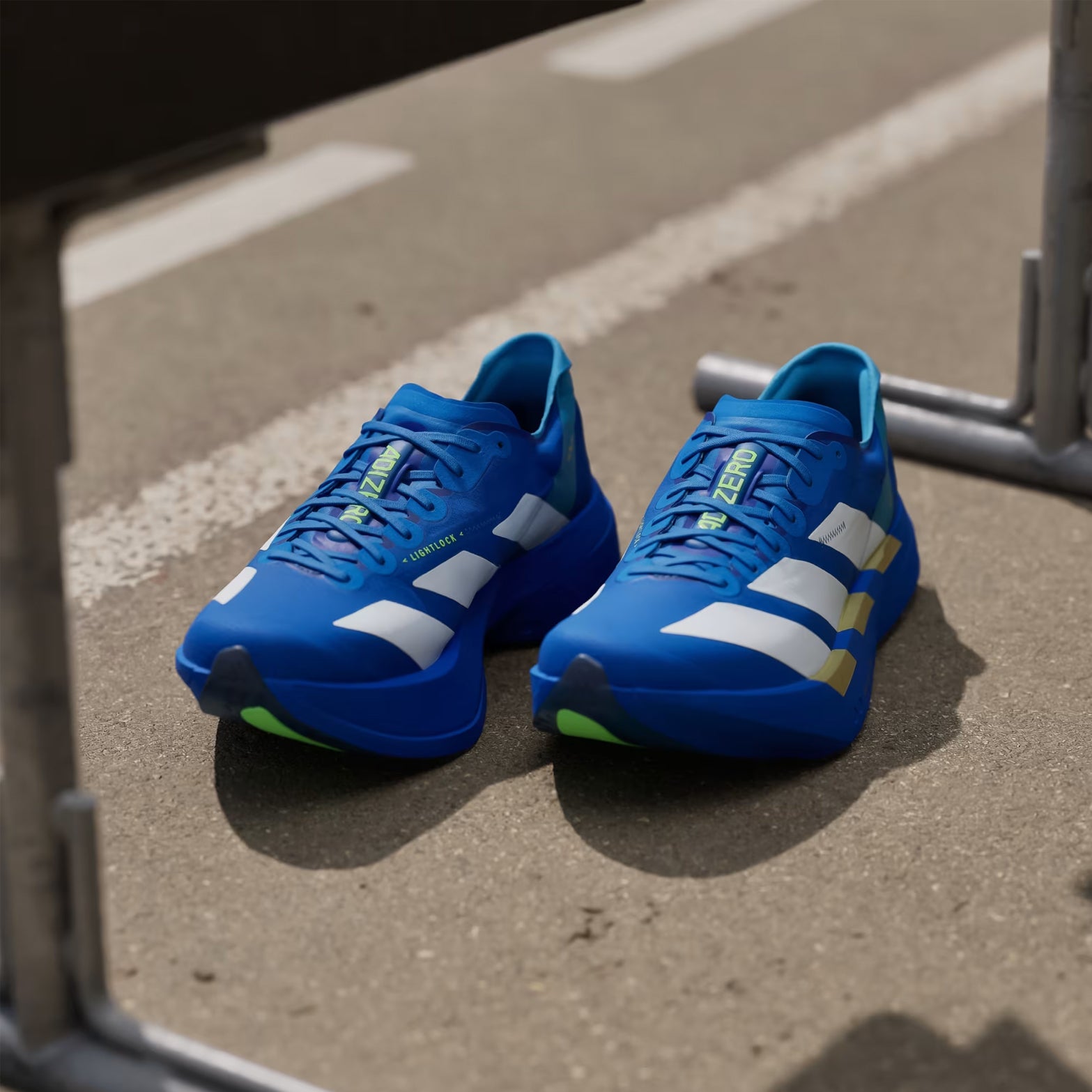 Men's adidas Adizero Adios Pro 4 Running Shoes Blue Cloud White Lime Burst angled top view showing lightweight racing upper construction with carbon-plated design for competitive racing