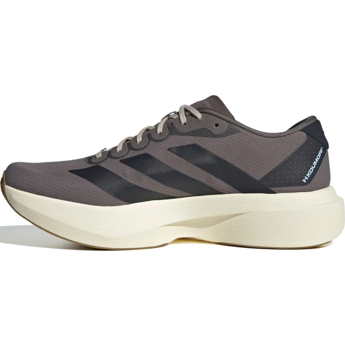 A side view of the Adidas Men’s Adizero EVO SL Woven H.Koumori Running Shoe in Charcoal/Night Grey/Clear Sky, featuring black stripes, white laces, and a thick off-white sole with LIGHTSTRIKE PRO technology—ideal for those seeking high-performance footwear.