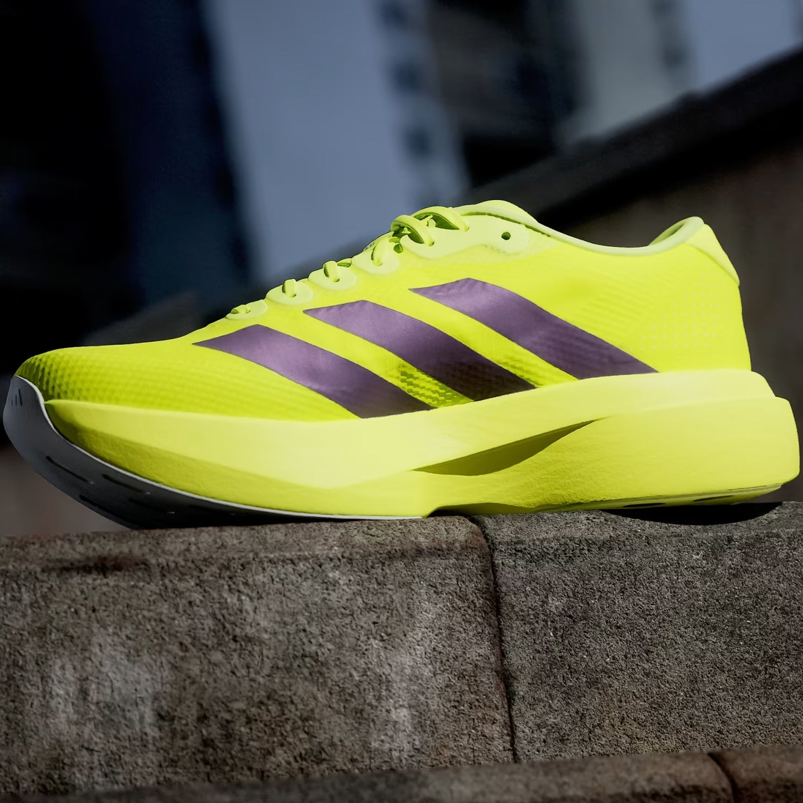 Men's adidas Adizero EVO SL Woven Running Shoes Solar Yellow Aurora Plum Powder Plum outer angled view showing woven racing-inspired aesthetic with LIGHTSTRIKE PRO foam for versatile running and lifestyle wear