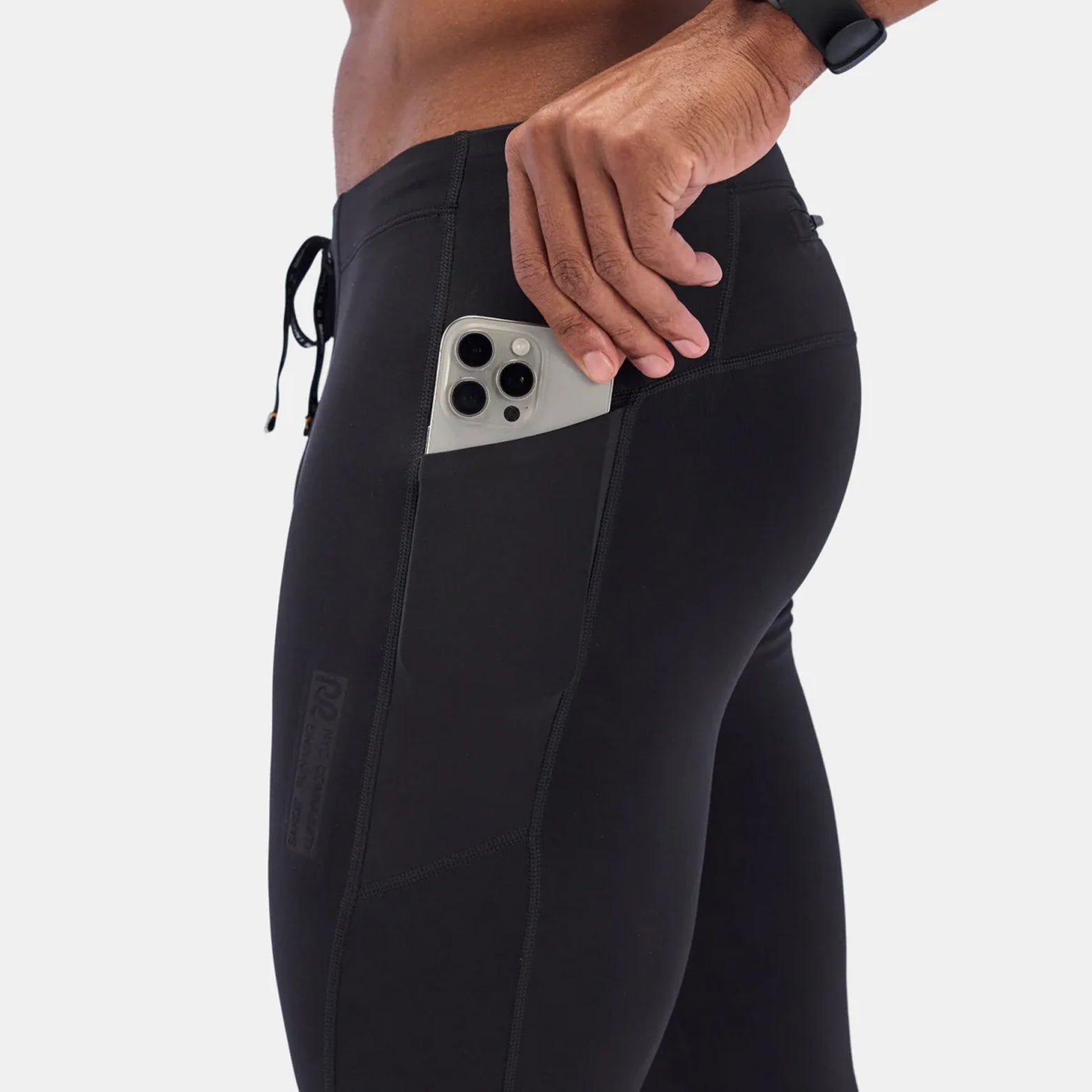 Bandit Brushed Stamina tights black side view showing waterproof iPhone pocket on thigh for secure phone storage during winter runs
