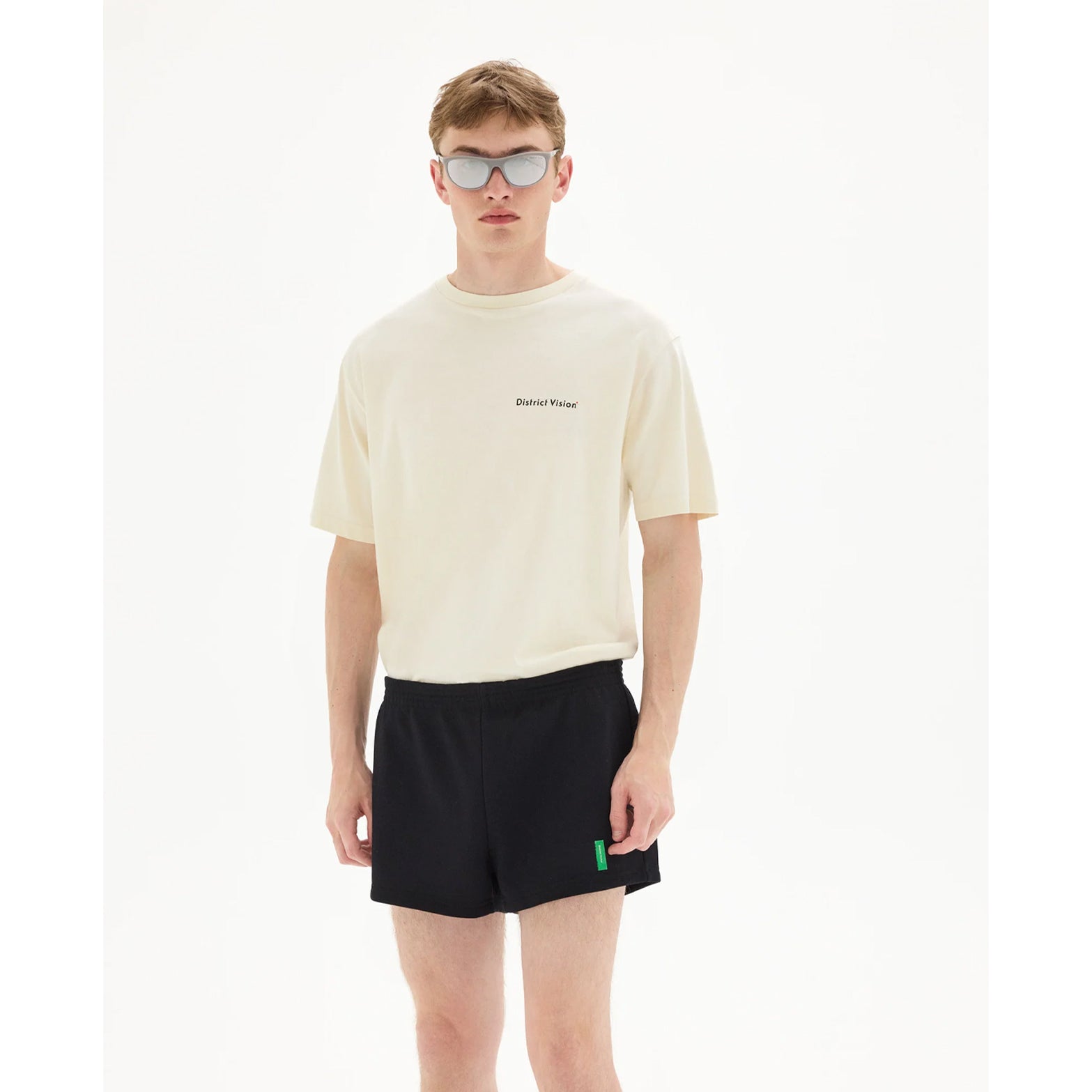 District Vision California Cotton Tee men's in Arrow Eye Vintage White — front view worn on model showing relaxed fit, Arrow Eye graphic print and vintage white pigment dye stone wash cotton drape