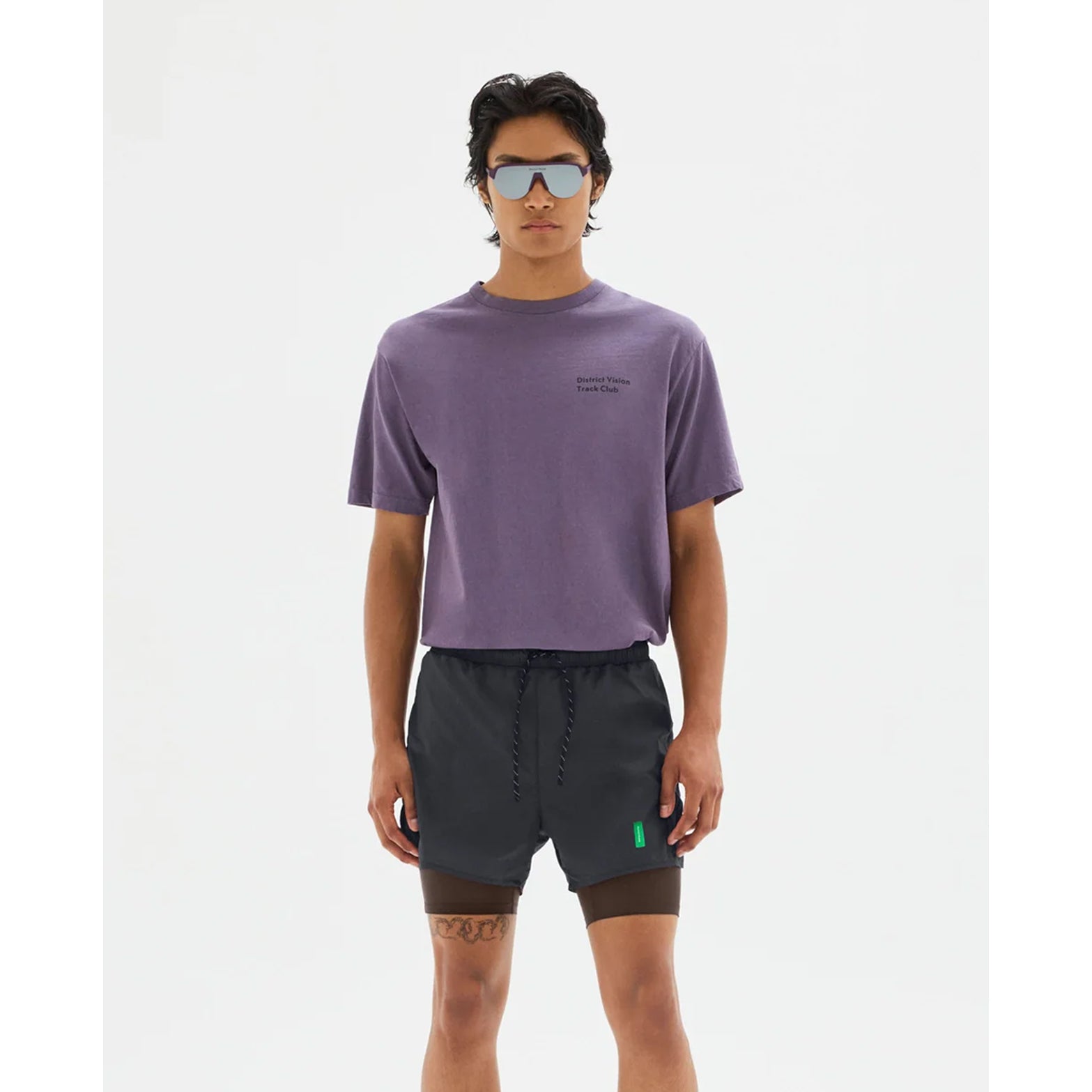 District Vision California Cotton Tee men's in Track Club Vintage Plum — front view worn on model showing relaxed fit, Track Club graphic print and vintage plum pigment dye stone wash cotton drape