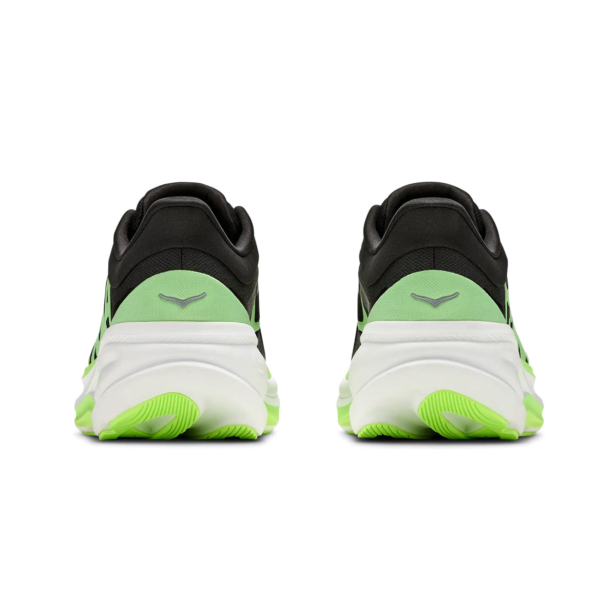 Back view of a pair of Hoka Men’s Clifton Pro Running Shoes in Carbon Black / Tart Apple, featuring black uppers with green accents and white soles. The shoes are side by side on a white background, displaying the Hoka logo on each heel. Part of the PROGLIDE+ series, this model includes an advanced SCF foam midsole for superior comfort and support.