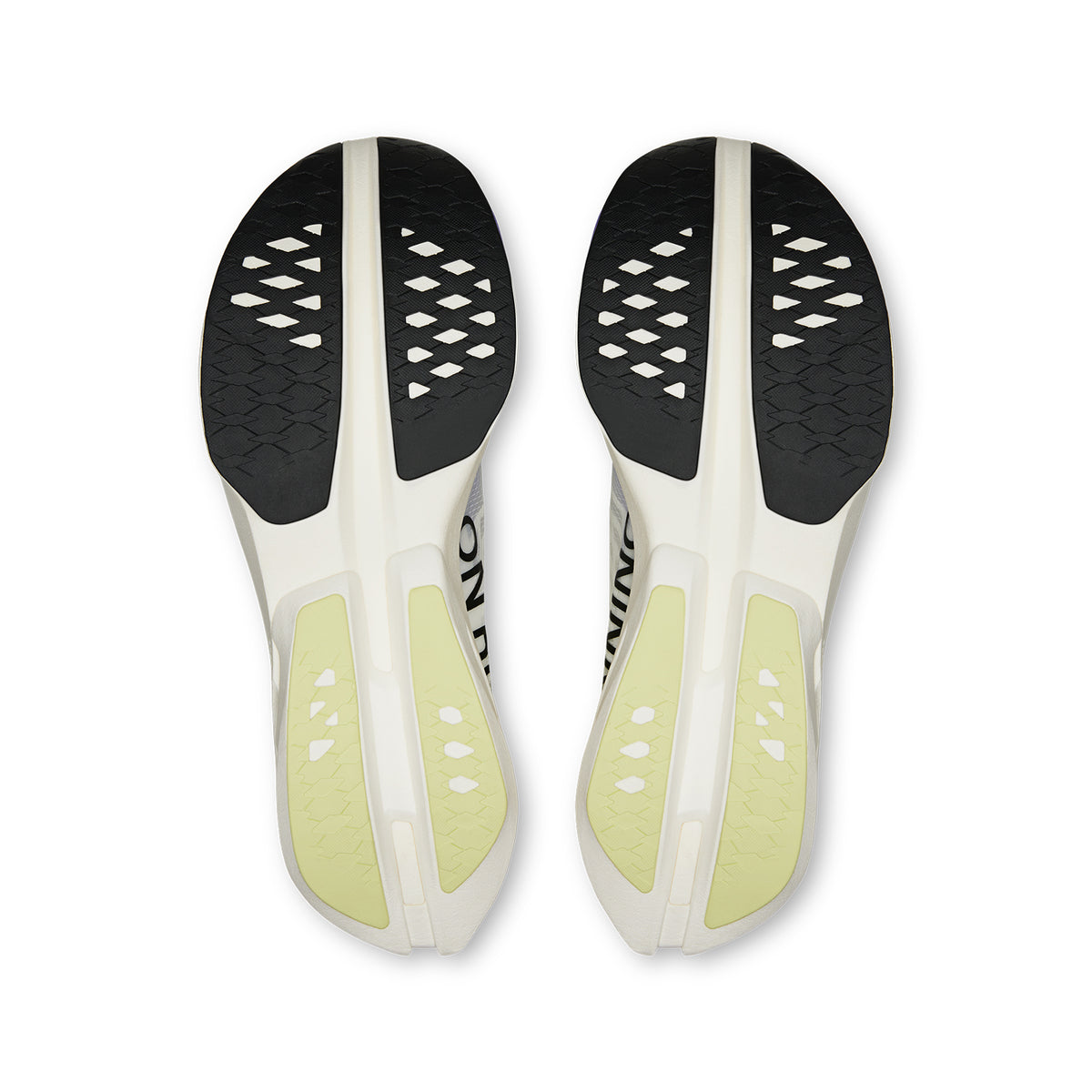 A pair of Men’s Cloudboom Strike running shoes by On, in the Juniper / Limelight colorway, are shown side by side with the soles facing up. The white athletic outsoles feature black and yellow-tinted rubber grip sections and a distinctive diamond-shaped cutout pattern on the bottoms. Designed with a carbon fiber Speedboard for ultra-responsive cushioning, these marathon racing shoes are an ideal choice for dedicated runners seeking peak performance.