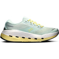The Men’s Cloudrunner 3 Max LN1 Running Shoes by On in Fresco/Gild feature a light blue and yellow colorway, thick sole, mesh upper, and lace-up design. Engineered with CloudTec for maximum cushioning and stability, the athletic running shoe is shown from the side on a white background.
