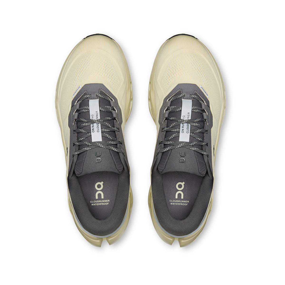 Top view of a pair of men’s Cloudrunner 3 WP Running Shoes in Pollen and Haze, with the On logo visible on the insoles and tongues. Featuring signature CloudTec stability, the shoes are neatly aligned side by side on a white background.