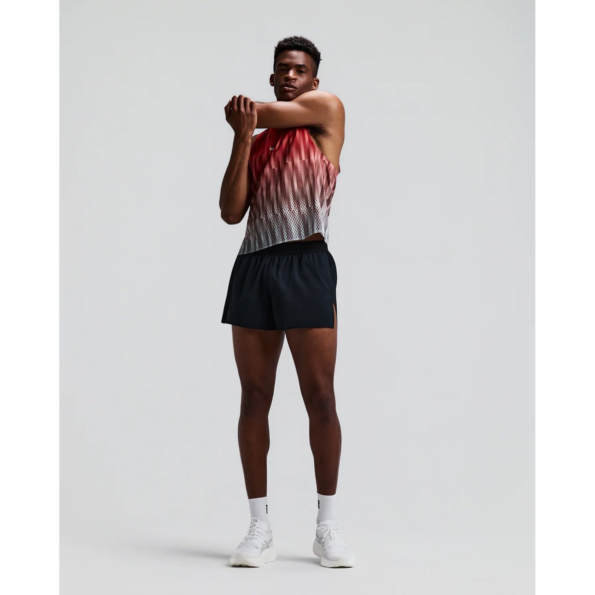 Men's Bandit CoolGrid 3 Inch Split Shorts Black front full body view on male runner showing 3-inch split design with mid-rise fit and breathable CoolGrid fabric for road running and racing