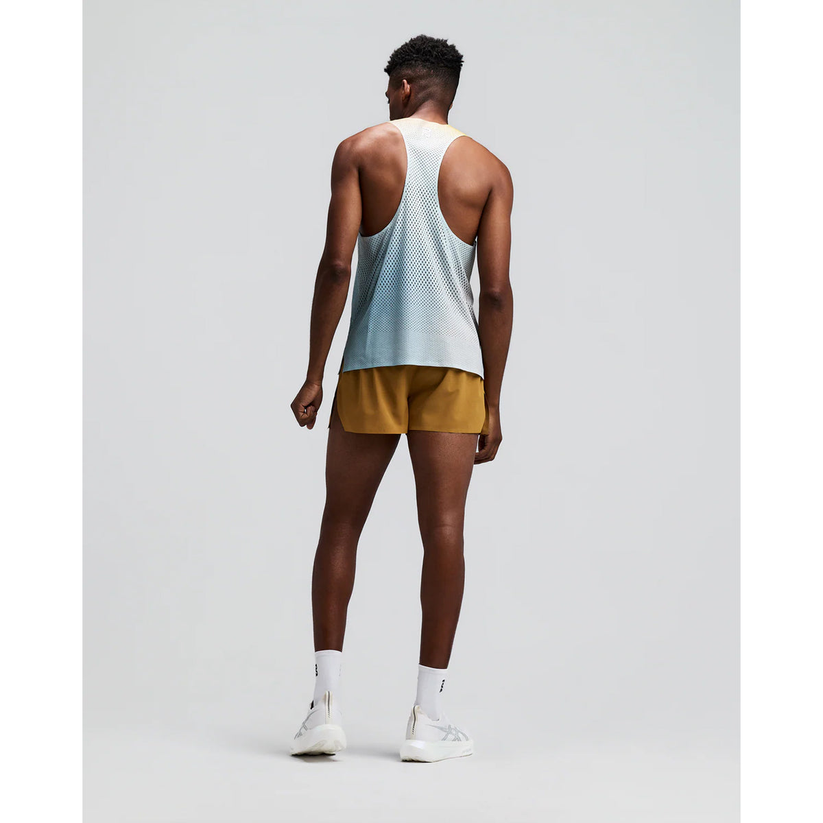 Men's Bandit CoolGrid 3 Inch Split Shorts Copal back full body view on male runner showing split design with reflective centre back branding and CoolGrid breathable construction