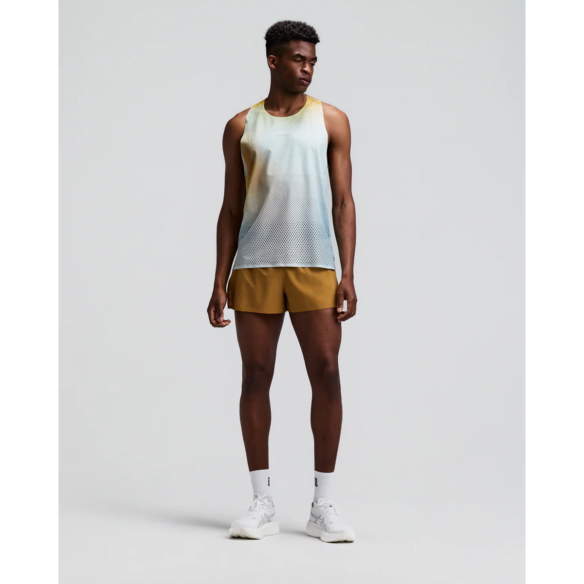 Men's Bandit CoolGrid 3 Inch Split Shorts Copal front full body view on male runner showing 3-inch split design with mid-rise fit and breathable CoolGrid fabric for road running and racing