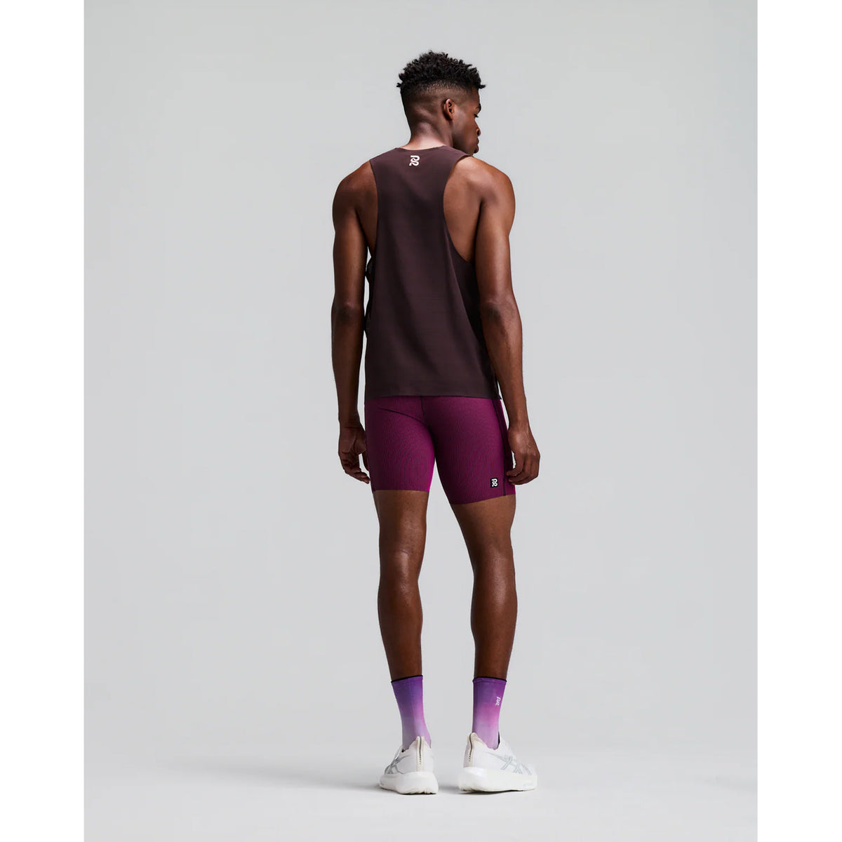 Men's Bandit CoolGrid Training Singlet with Flopack Espresso back full body view on male runner showing Flopack airflow technology with bonded seam construction and two-tone reflective graphics for breathable training performance