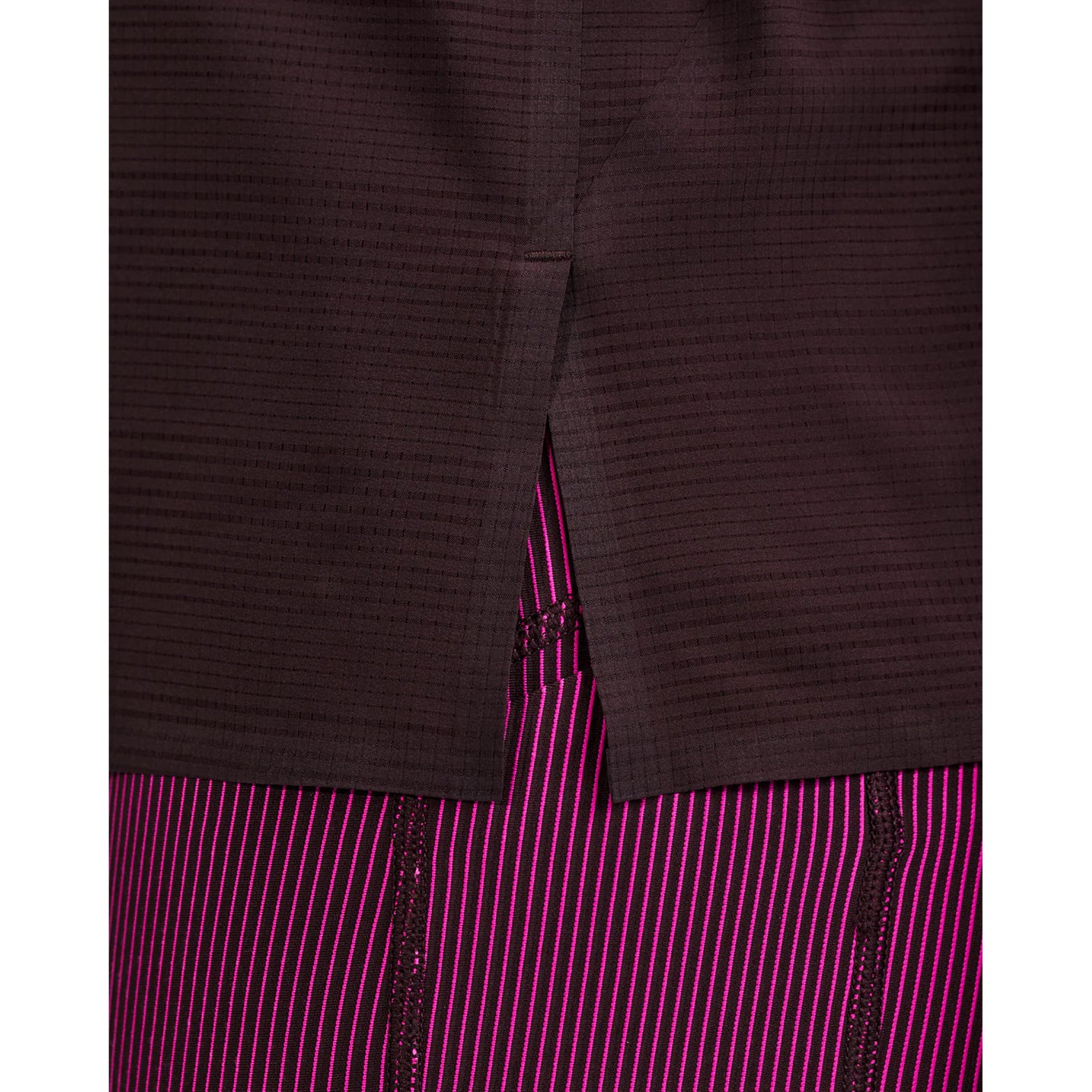 Men's Bandit CoolGrid Training Singlet with Flopack Espresso close-up of hem slit showing side slit construction for unrestricted movement and freedom during training and racing efforts