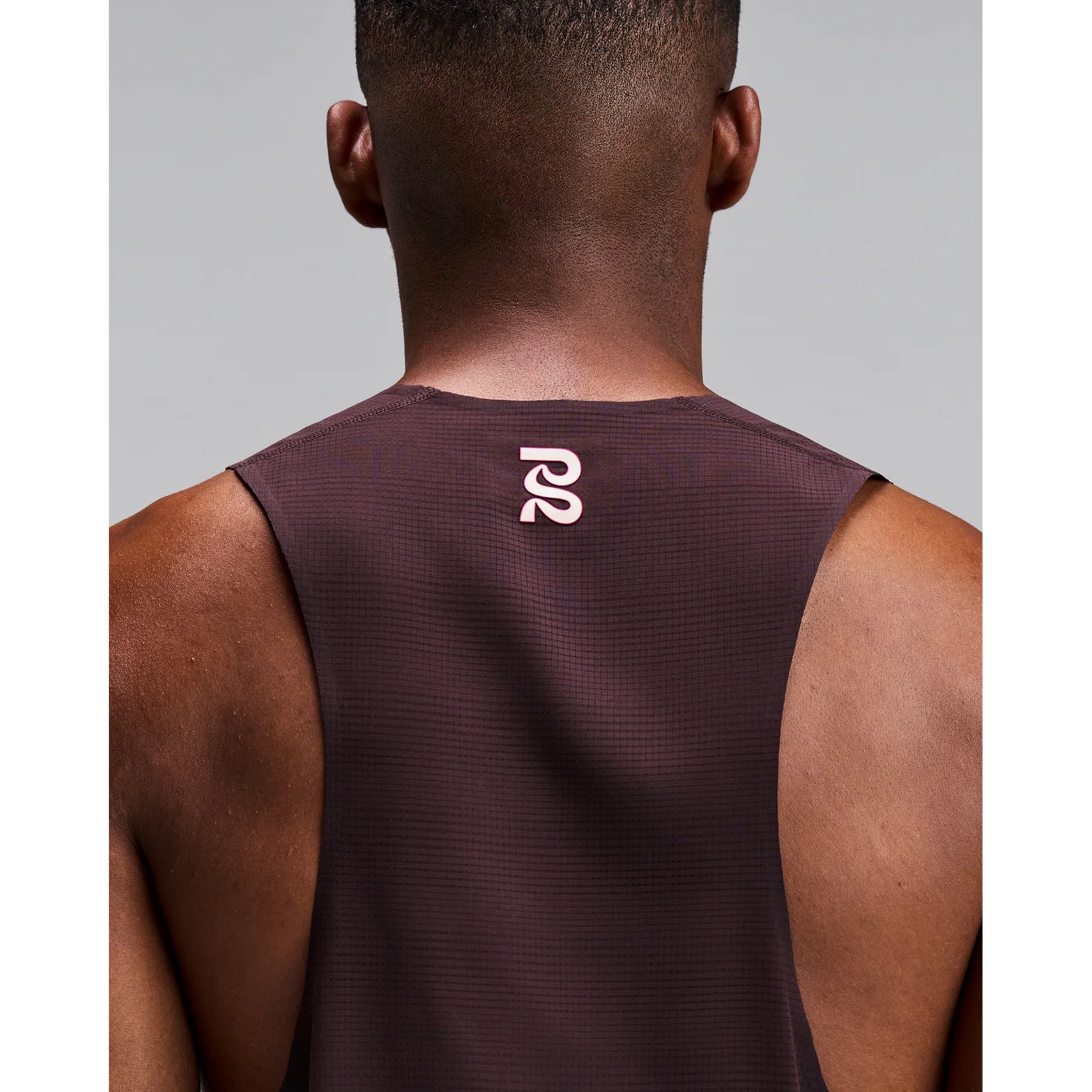Men's Bandit CoolGrid Training Singlet with Flopack Espresso close-up of back showing two-tone reflective Bandit logo with Flopack bonded slit system and pop-colour tape detail for low-light visibility during training