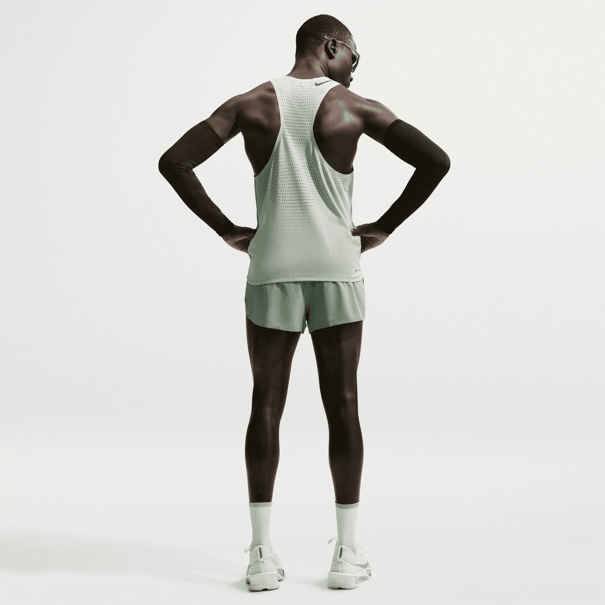 Men's Nike Dri-FIT AeroSwift ADV 2 Inch Running Shorts Steam Black back full body view on male runner showing 2-inch racing construction with updated side seam stitching for extra coverage