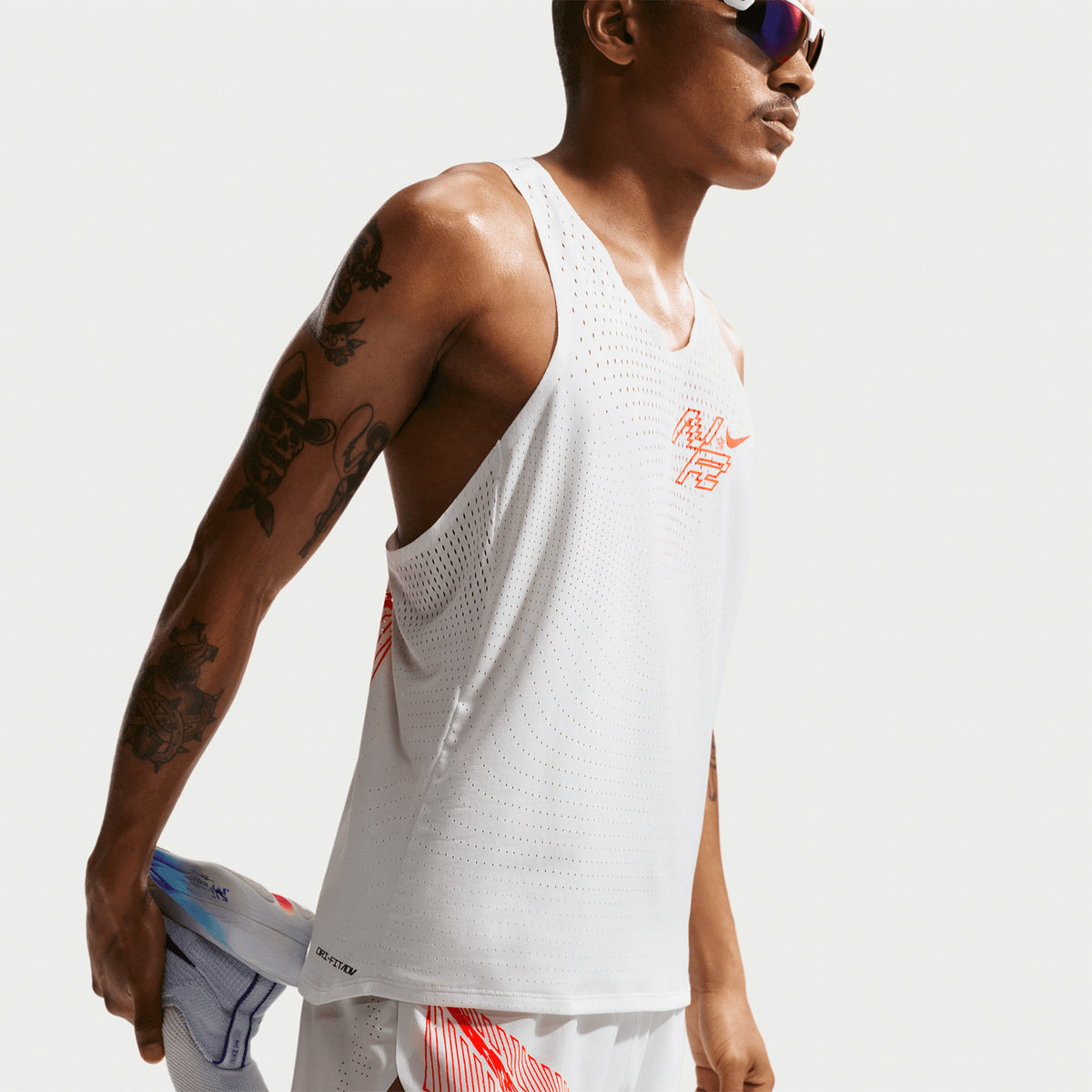 Nike Men's Dri-FIT AeroSwift ADV 2 inch shorts in Summit White — side view worn on model showing summit white Dri-FIT ADV lightweight woven material, 2 inch inseam racing fit and knit liner support with extended side seam coverage
