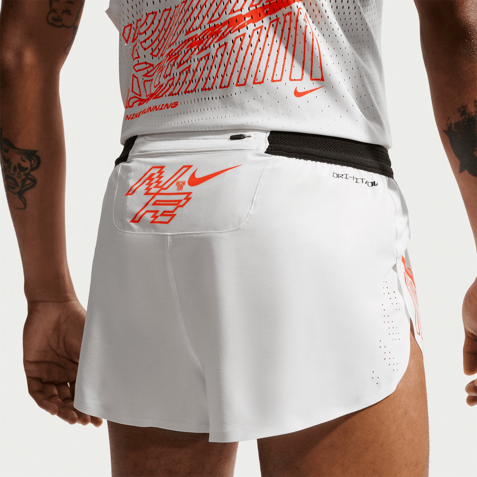 Nike Men's Dri-FIT AeroSwift ADV 2 inch shorts in Summit White — back view worn on model showing summit white lightweight woven material, zippered back pocket with non-reflective Swoosh logo and updated side seam stitching coverage
