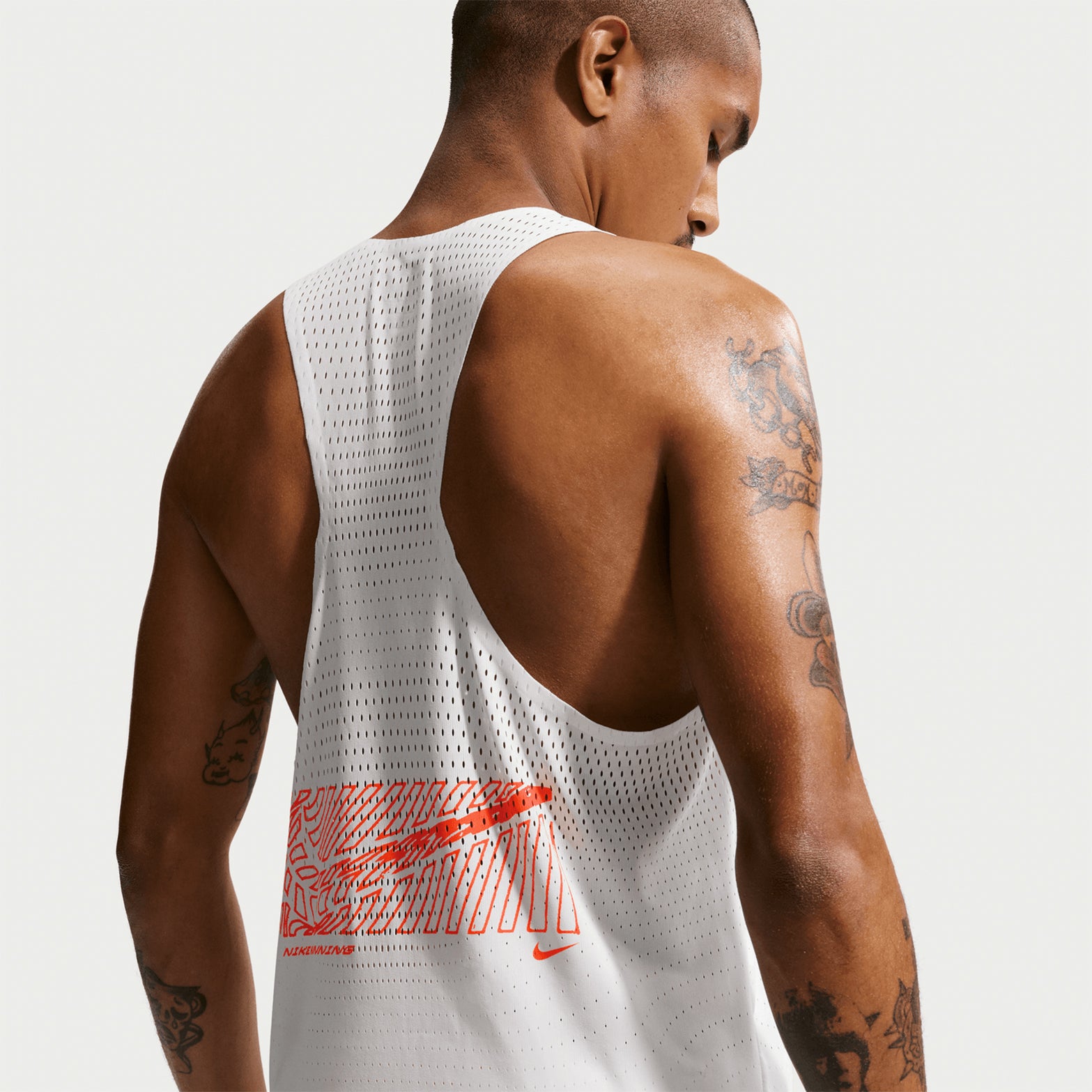 Nike AeroSwift men's Dri-FIT ADV running singlet in Summit White — back product shot showing summit white bonded seams at armhole, open-hole ventilation design and nonreflective Swoosh logo detail