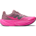 New Balance FuelCell Rebel v5 men's running shoe in Pink Heat / Rosewood — outer view showing pink heat streamlined mesh upper with rosewood accent detailing and geometric FuelCell midsole profile