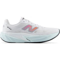 New Balance FuelCell Rebel v5 men's running shoe in White / Pink Heat / Glint Blue — outer view showing white engineered mesh upper with pink heat and glint blue accent detailing and FuelCell foam midsole profile