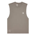 The Bandit Men’s Micromesh Run Tank in Concrete Taupe is a sleeveless, light brown running top crafted for sweat-wicking performance. Featuring a breathable micromesh fabric, it helps keep you cool and comfortable during workouts. The tank displays a small white Bandit logo on the left chest and white lettering near the bottom hem, shown laid flat against a white background.