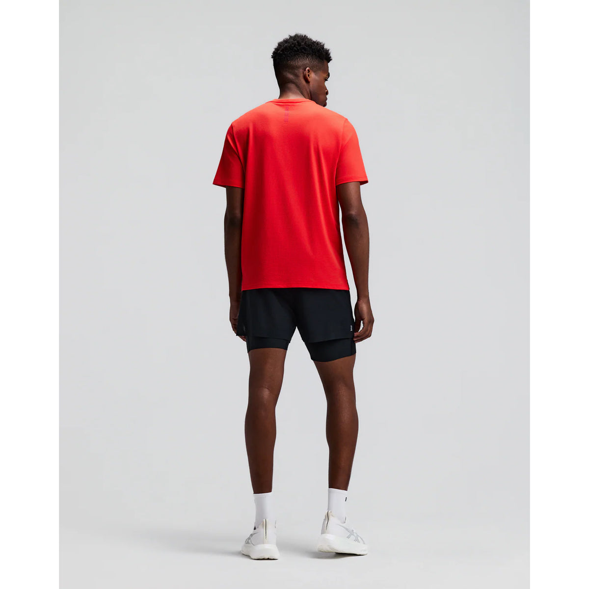 Men's Bandit Micromesh Run Tee Poppy back full body view on male runner showing relaxed fit with fast-drying Micromesh construction for comfortable running and training