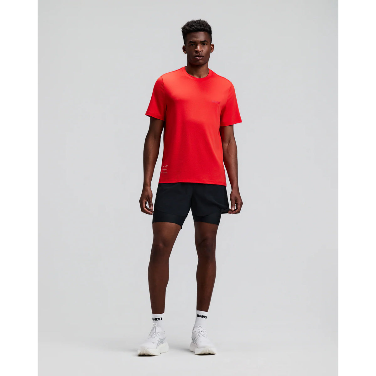 Men's Bandit Micromesh Run Tee Poppy front full body view on male runner showing comfortable fit with crew neckline and breathable Micromesh moisture-wicking for training and everyday running