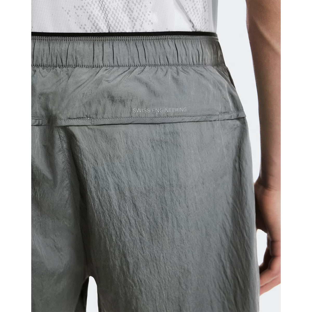 Men's On Performance Volt Shorts Glacier close-up of Swiss engineering detail showing On DryTec technology with windproof water-repellent construction and multiple storage solutions