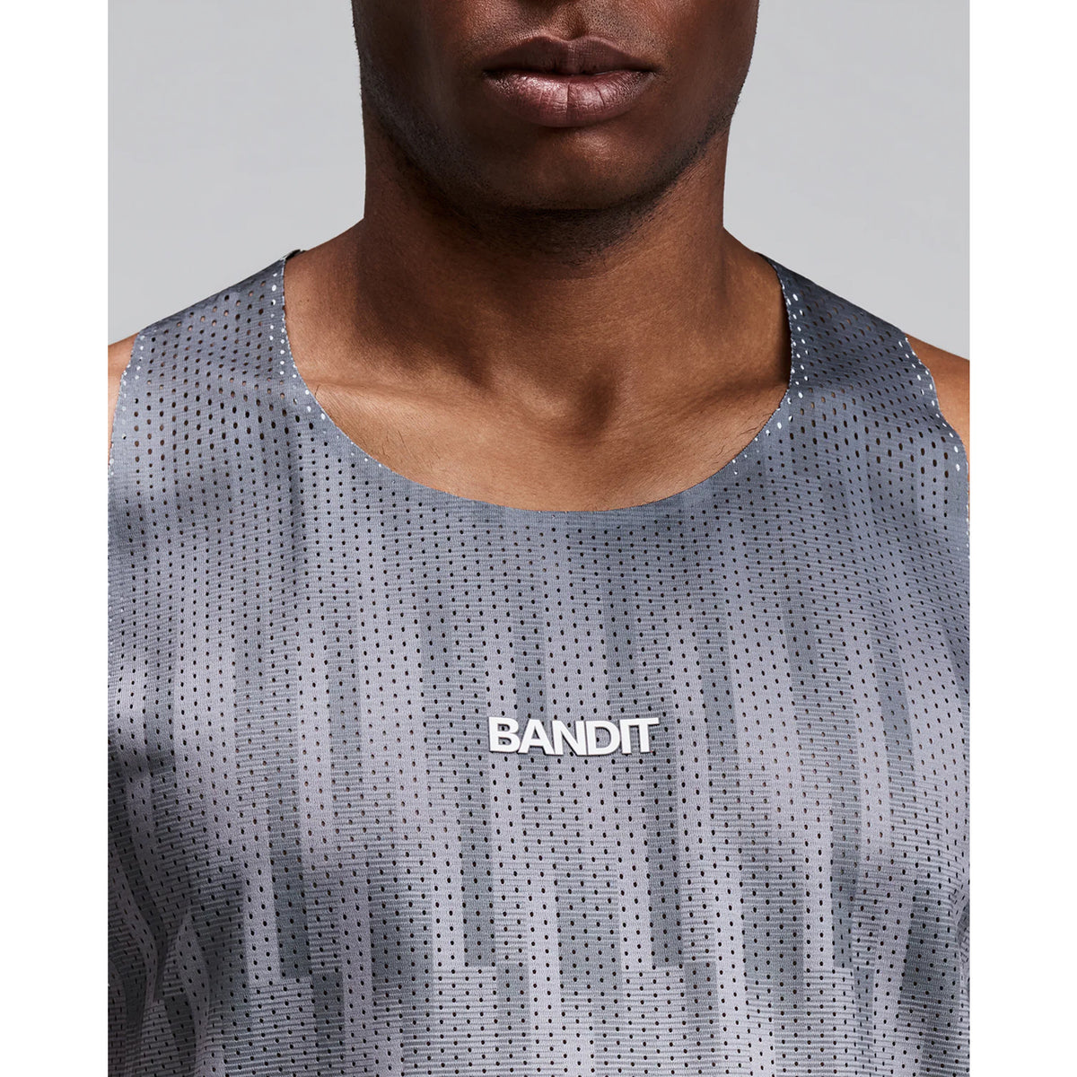 Men's Bandit Shredder Shorty Race Singlet Uneven Gradient Plaster close-up of front showing Shredder gradient mesh with bonded seams and two-tone reflective Bandit branding
