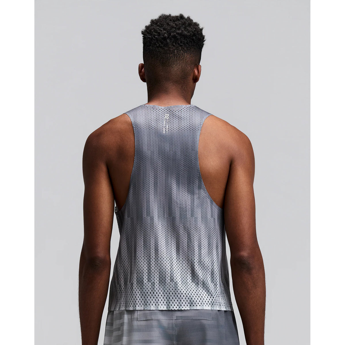 Men's Bandit Shredder Shorty Race Singlet Uneven Gradient Plaster back view on male runner showing racer back design with two-tone reflective branding and side hem slits for freedom of movement