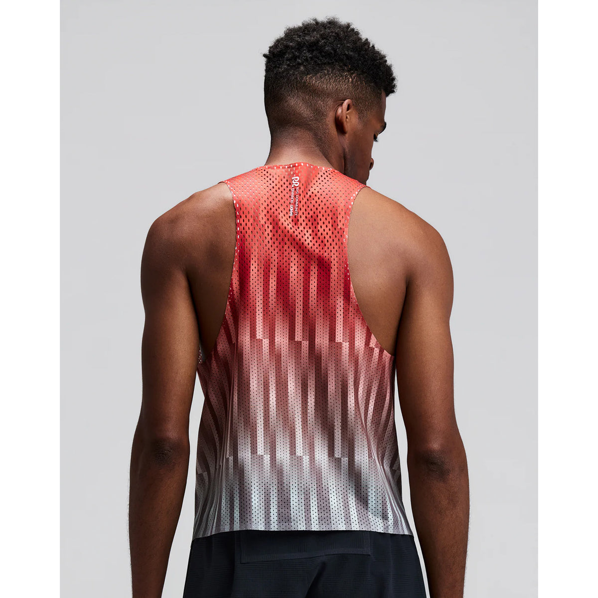 Men's Bandit Shredder Shorty Race Singlet Uneven Gradient Poppy back view on male runner showing racer back design with two-tone reflective branding and side hem slits for freedom of movement