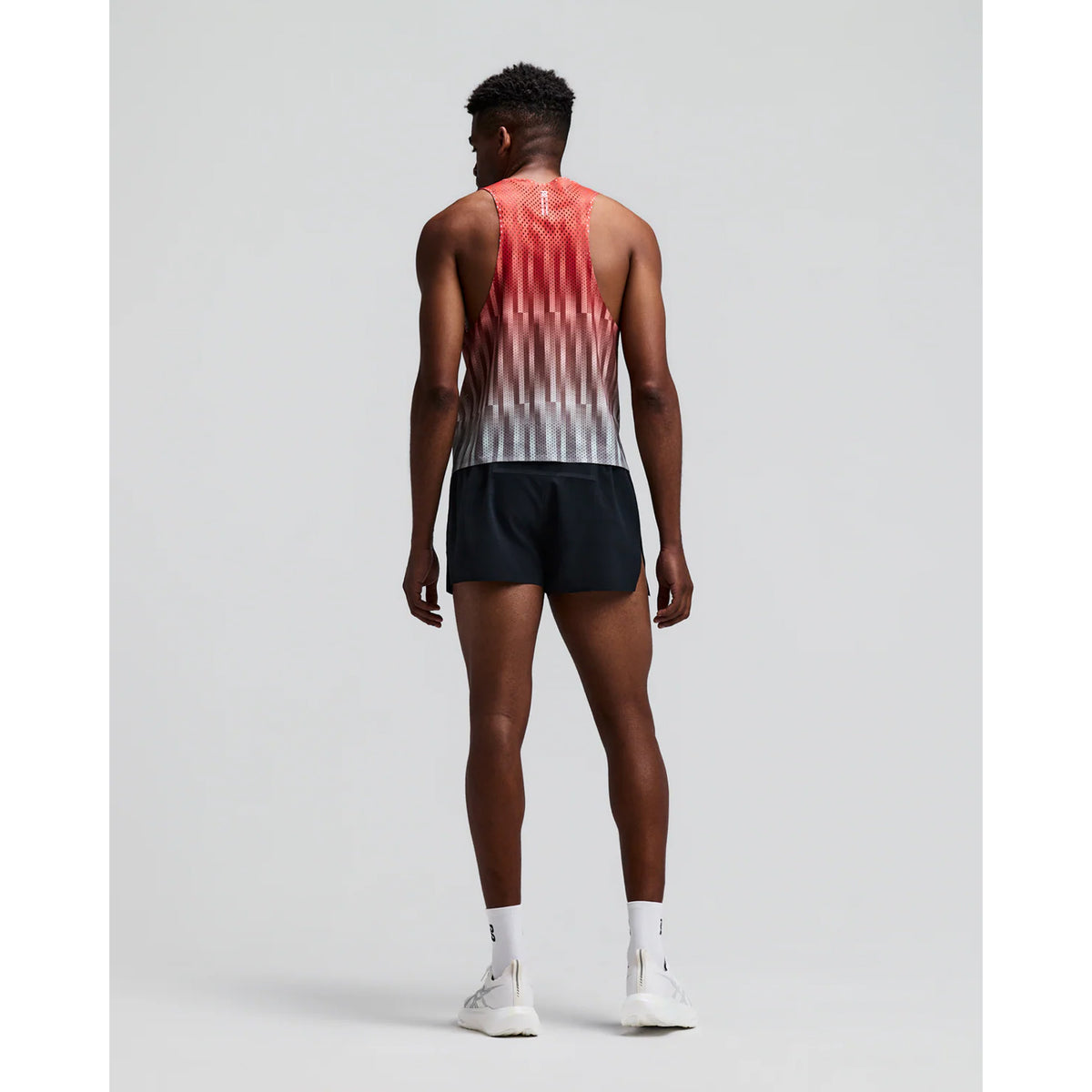 Men's Bandit Shredder Shorty Race Singlet Uneven Gradient Poppy back full body view on male runner showing racer back design with side hem slits and reflective branding for breathable race day running