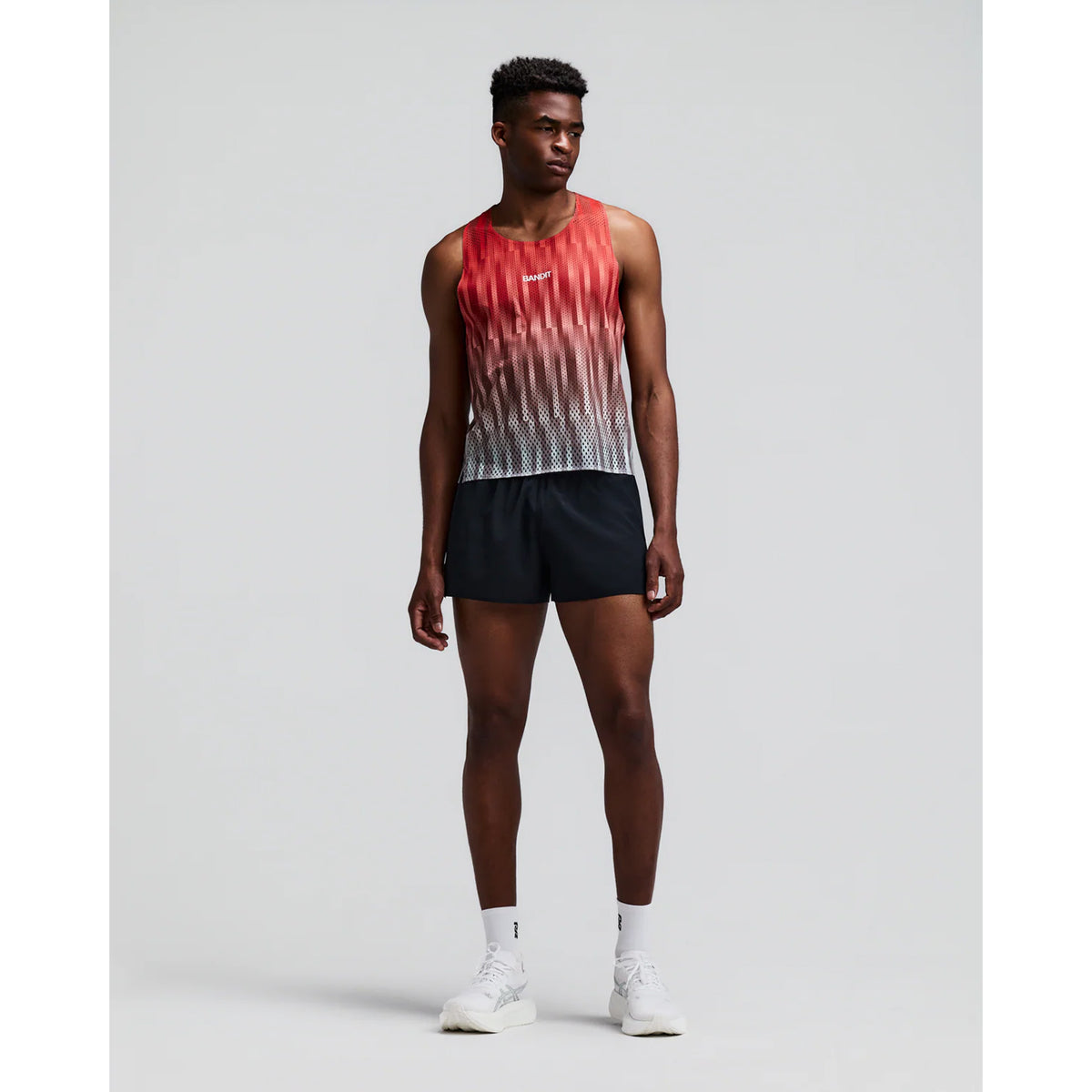 Men's Bandit Shredder Shorty Race Singlet Uneven Gradient Poppy front full body view on male runner showing cropped gradient mesh singlet with high neckline and bonded seams for race day performance