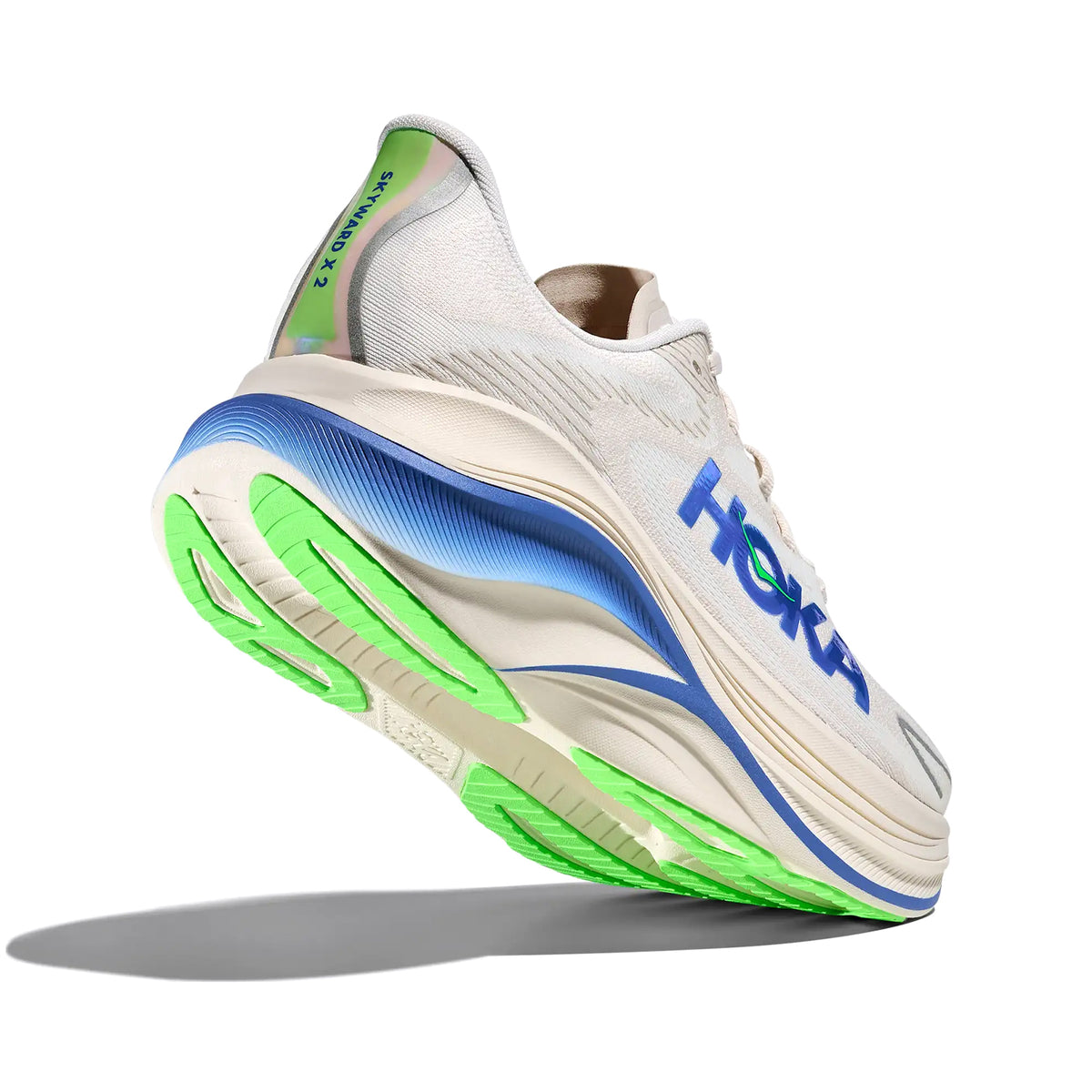 HOKA Skyward X 2 men's running shoe in Grout / Cobalt — angled side view showing grout creel jacquard upper, convex carbon plate geometry and cobalt PEBA foam midsole stack with reflective details