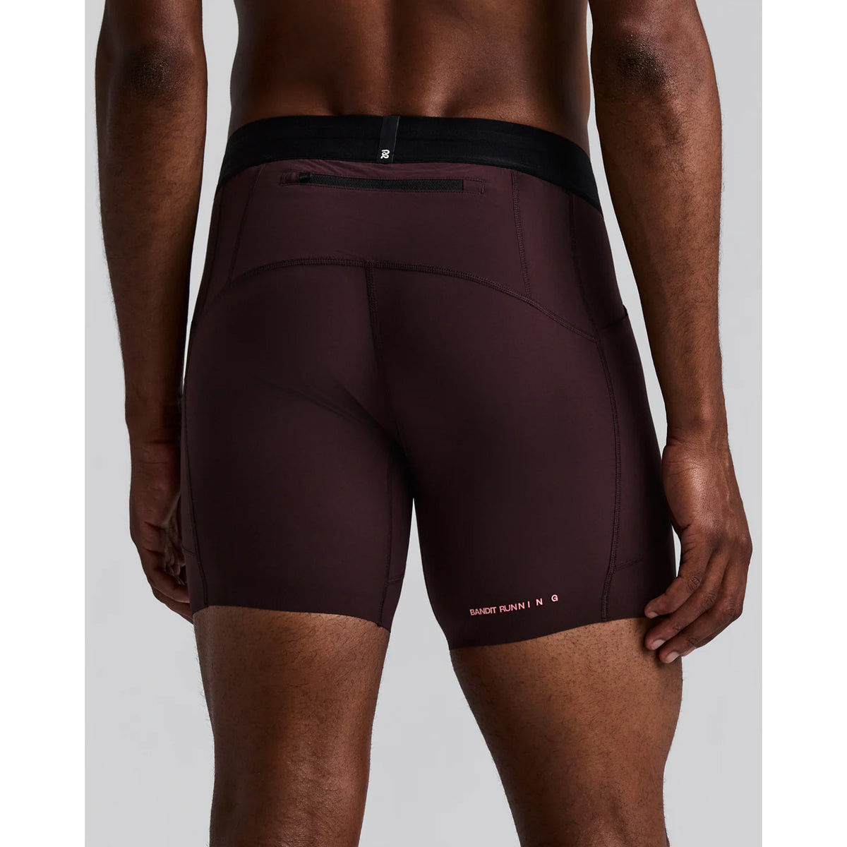 Men's Bandit SoLite Quarter Tights Espresso back view on male runner showing waterproof zip pocket at centre back with GripDot hem grip technology and custom two-tone branding